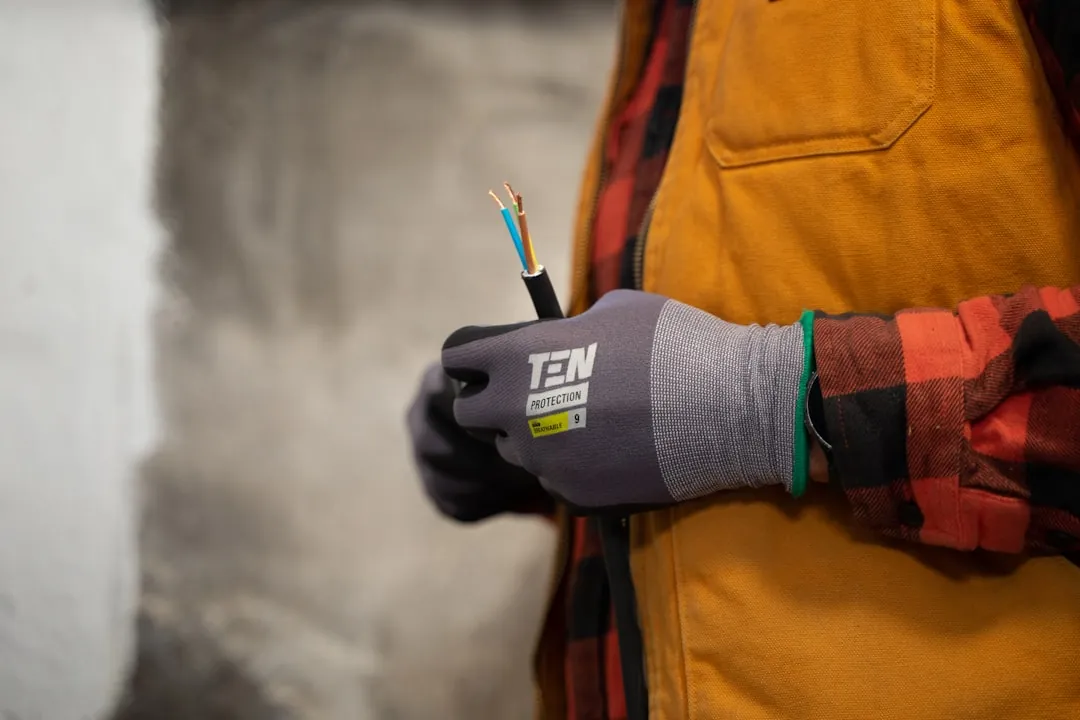 Electrician holding a stripped power cable